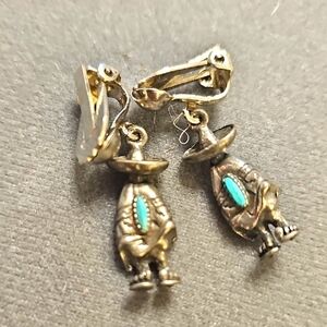 Silver and Turquoise Clip-On Earrings. Detail, You Can See His Toes.